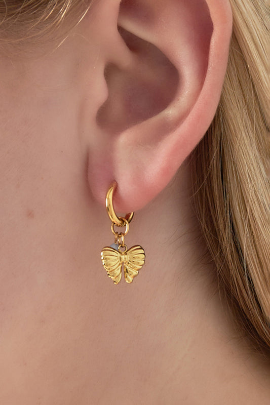 Earrings with hanging bow charm and bead