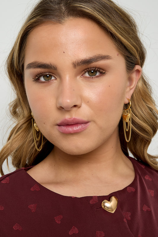Hoop earrings with hanging chains and heart
